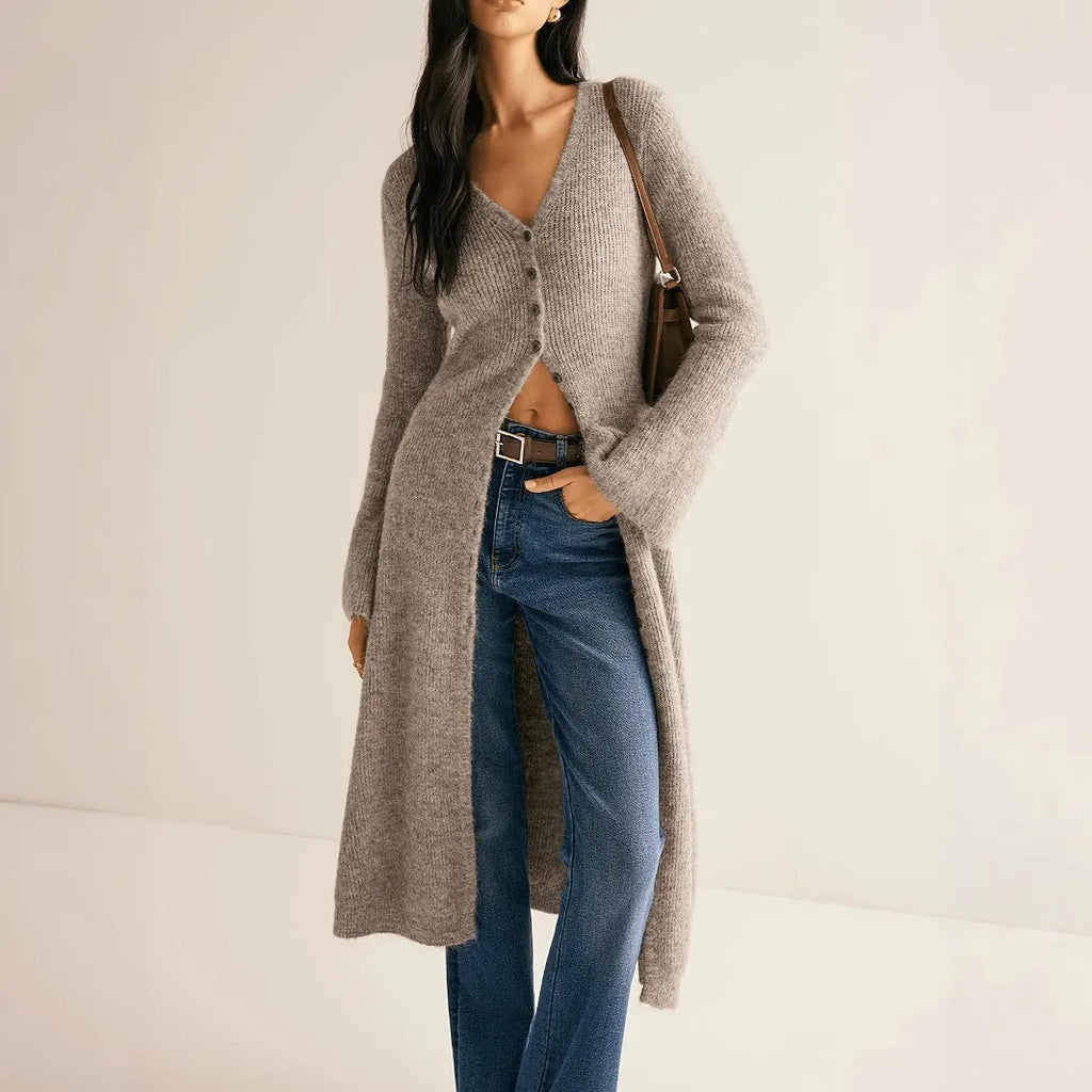 Khaki coloured long sleeve button-front cardigan with a French retro style on a hanger.