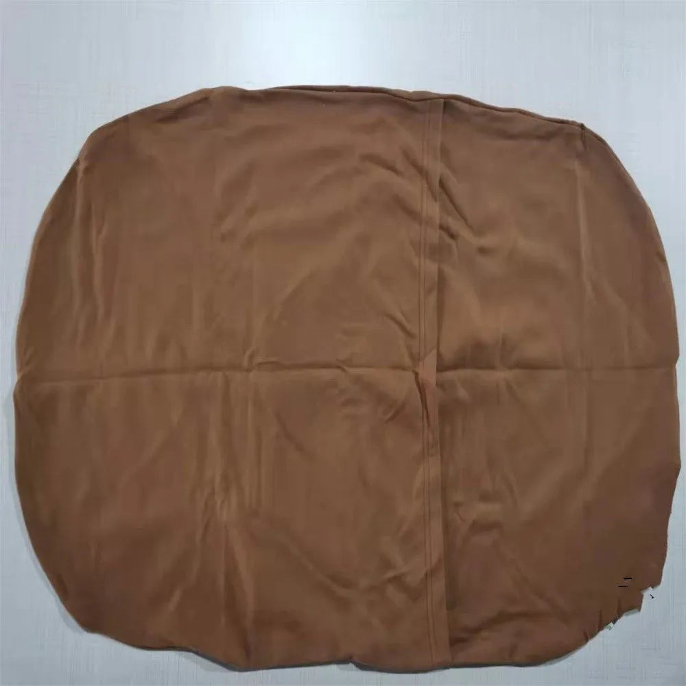 Beige portable cotton baby nest crib for newborns on a neutral background