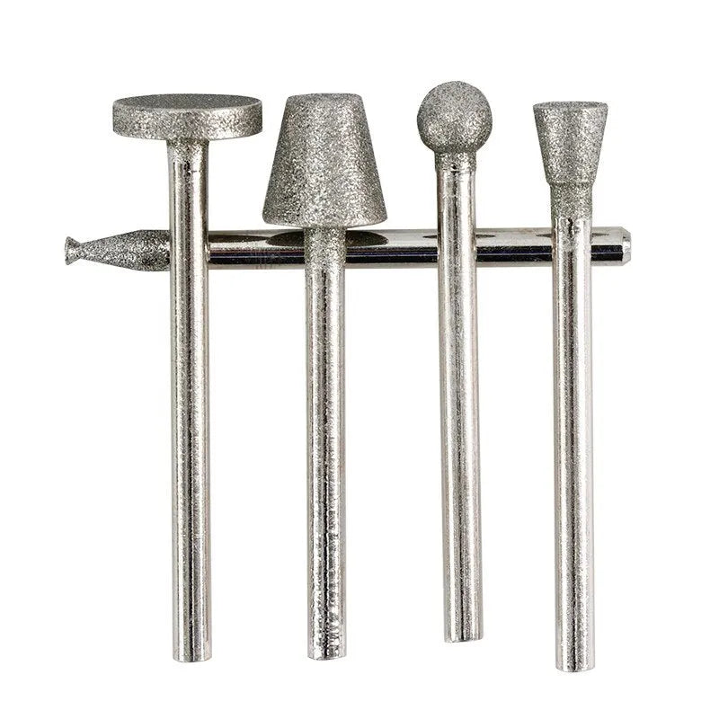Set of alloy diamond grinding heads with elliptical cone shape and 3mm shank for rotary tools.
