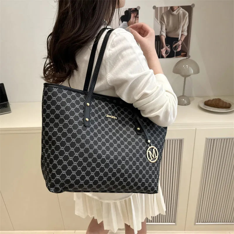 Street style PU shoulder bag with adjustable strap in black colour showing sewing thread detail