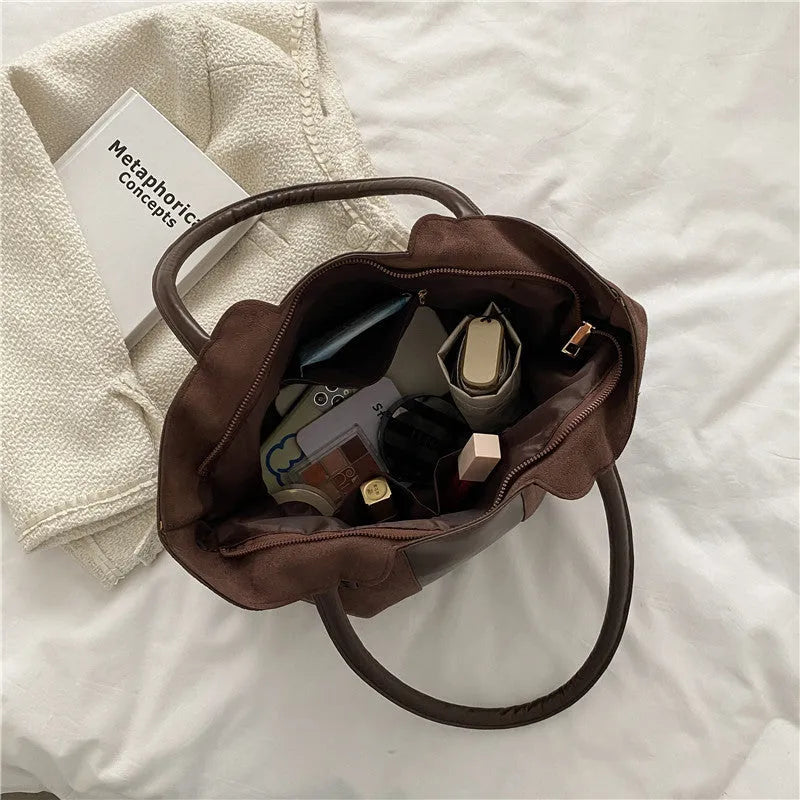 Women's large nylon tote bag in black with detachable shoulder strap, polyester lining, phone and document pockets
