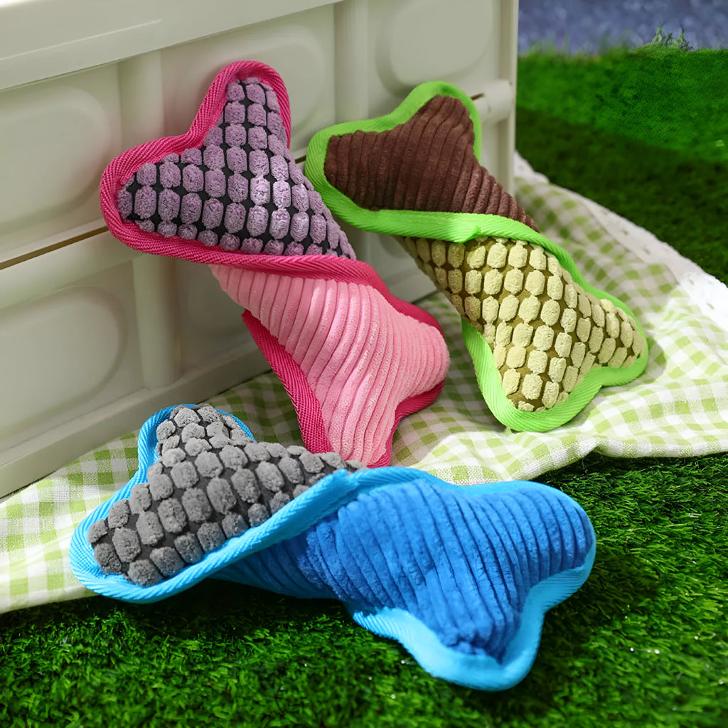 Blue teddy dog toy with a bone model and corn fleece lining for bite-resistant play.