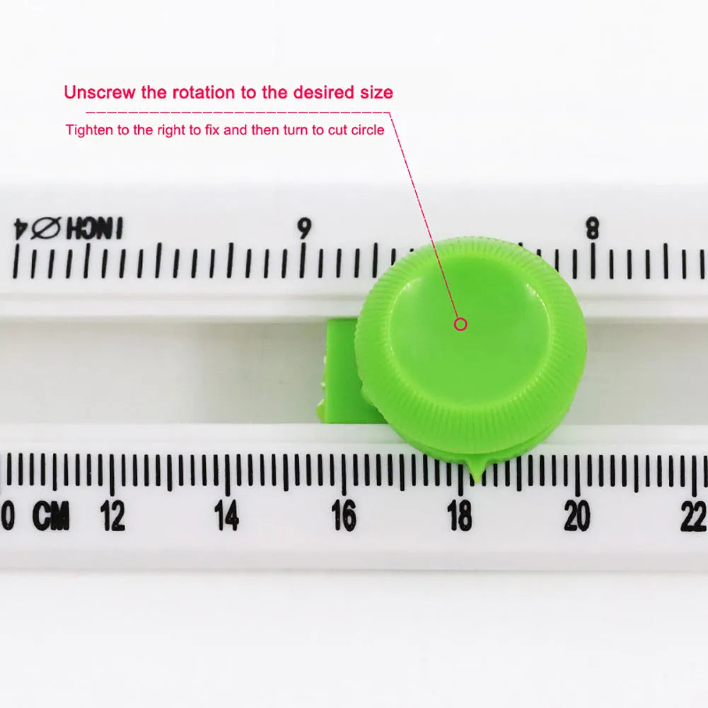 Plastic round paper cutter in orange or green colour on a colour box, showing A3 cutting size.