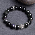 Obsidian and 999 silver beaded bracelet showing Jucai NAFU stone detail in two size options.