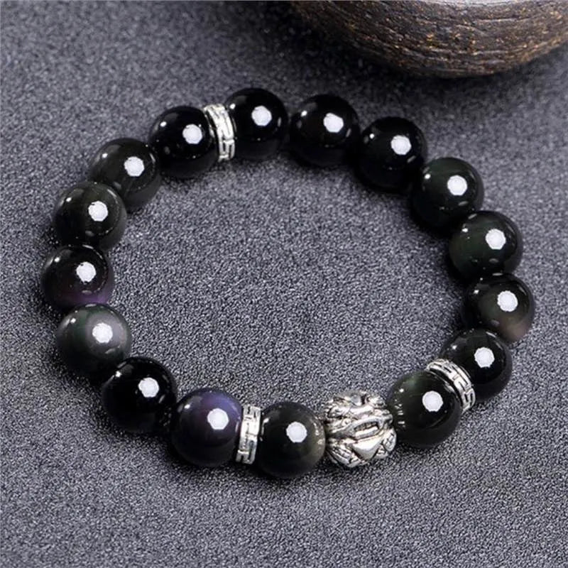 Obsidian and 999 silver beaded bracelet showing Jucai NAFU stone detail in two size options.