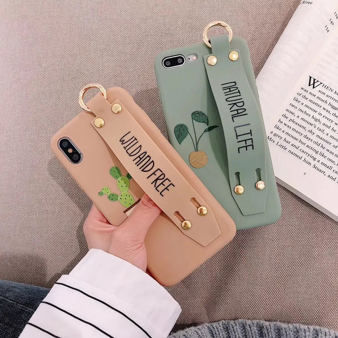 Green iPhone case with a detachable wristband and graffiti print on the back.