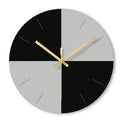 Transparent tempered glass minimalist wall clock with silent movement on a wall.