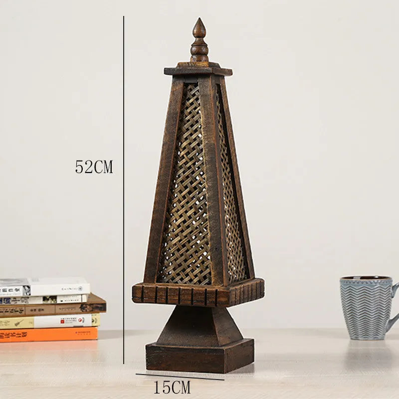 Retro wood table lamp with hand-woven straw rattan lampshade on a desk