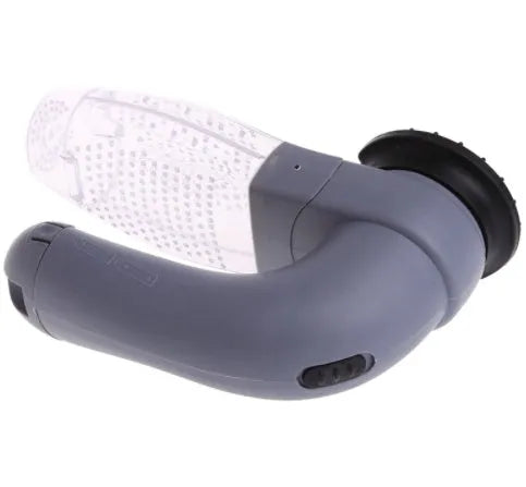 Grey portable pet hair vacuum cleaner with soft rubber grooming head on a fabric sofa