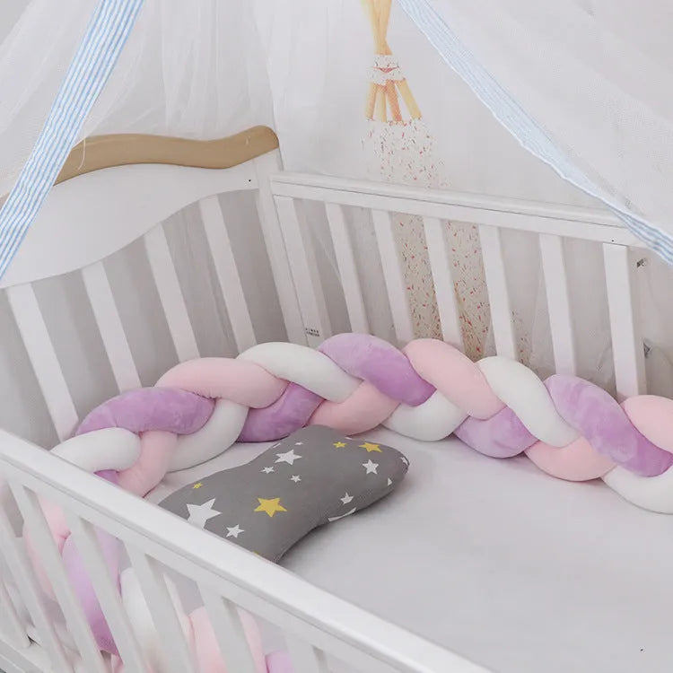 Baby crib bumper braid knot pillow cushion in spandex velvet fabric, shown in a multi-colour option.