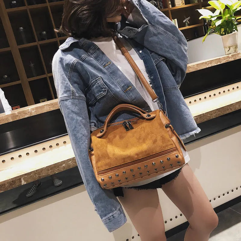 Soft PU leather women's tote shoulder bag in black, shown with smooth zipper and large main compartment.