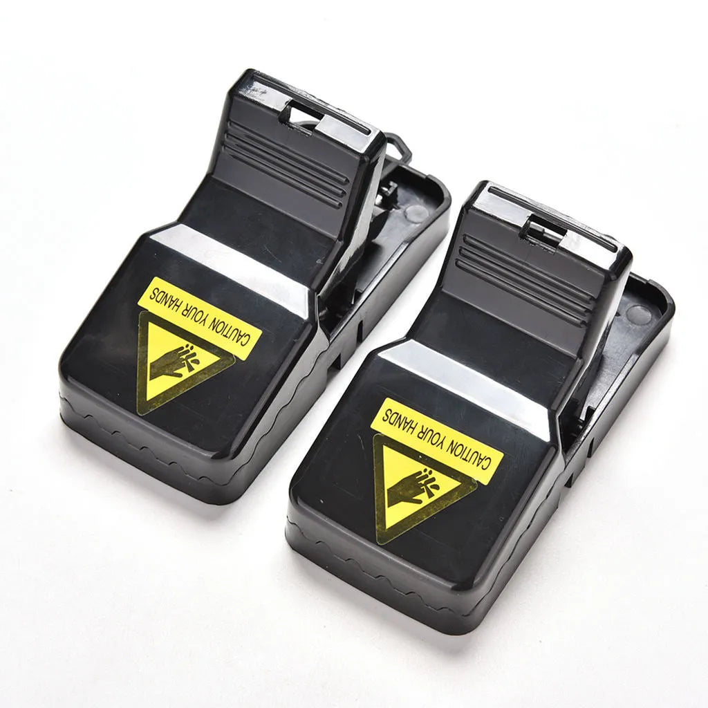Pack of six black plastic mousetraps showing snapping mechanism and measurements
