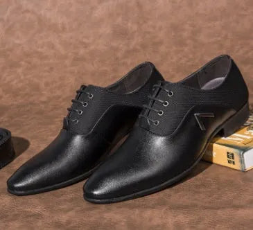 Men's black artificial leather Oxford shoe with a low top and rubber sole on a white background.