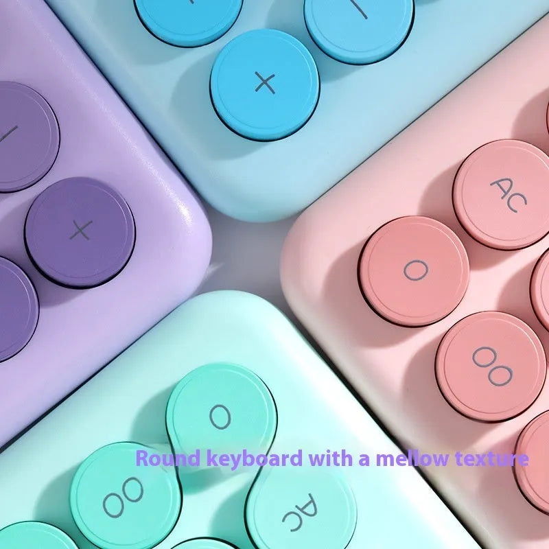 Gradient colour desktop calculator in ABS plastic showing violet, blue, green, and pink colour options