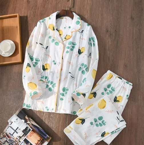 Traditional polyester maternity pajama set with turn-down collar, full bell sleeves, and ankle-length trousers in solid natural colour