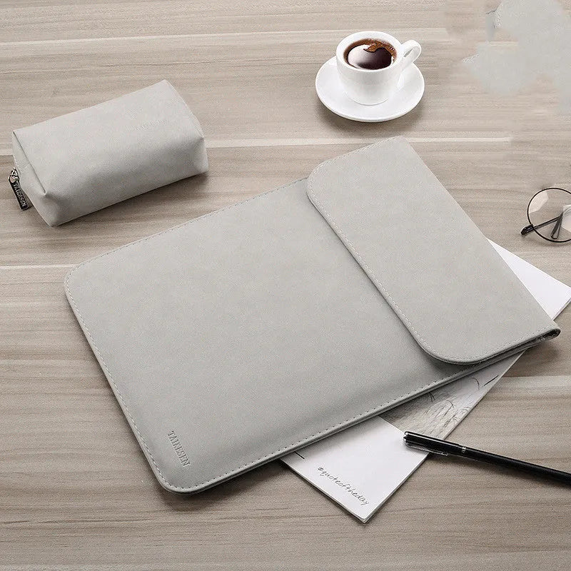 Micro velvet laptop liner bag for 13.3 inch notebook, available in multiple colours, lying on a desk