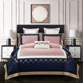 Four-piece cotton bedding set with embroidered detail on a satin weave fabric.