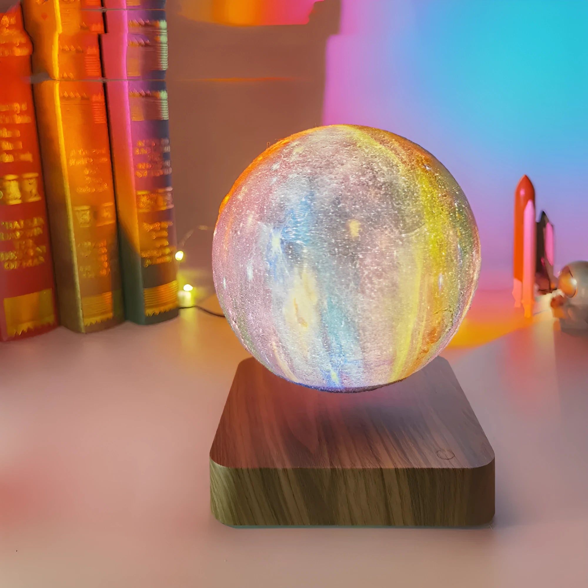 Magnetic levitation galaxy decorative light with floating moon lamp rotating above walnut-coloured base