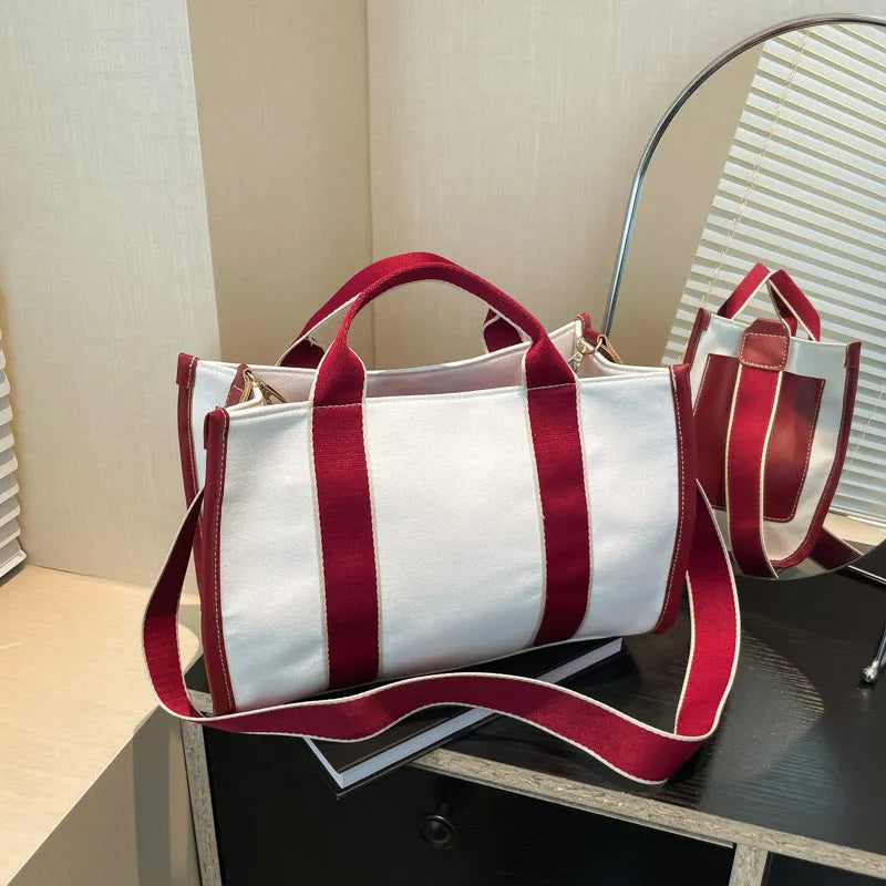 Women's canvas tote bag in horizontal square shape with open pocket, available in black