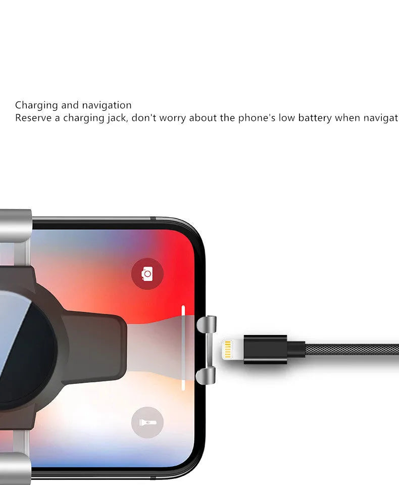 Black S4 gravity mirror ABS car phone mount attached to vehicle air conditioning vent holding smartphone