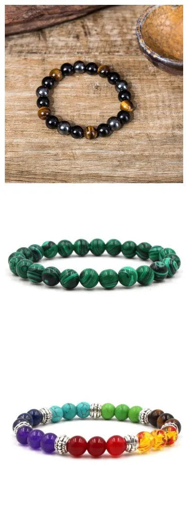 Malachite green and black matte 8mm round bead elastic strand bracelet on a neutral background