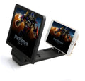 Black folding mobile phone stand with 3D screen amplifier on wooden desk