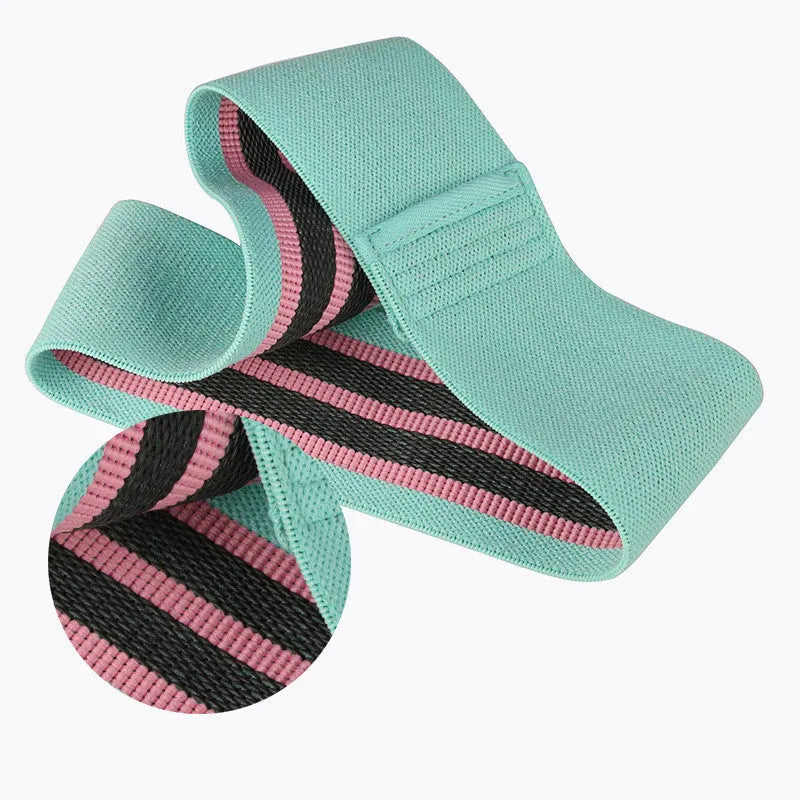 Squat resistance band hip ring in green, pink, or purple, made from latex silk and polyester webbing