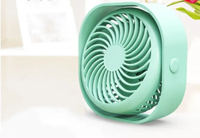 USB charging desk fan with alarm clock in blue colour on a desk