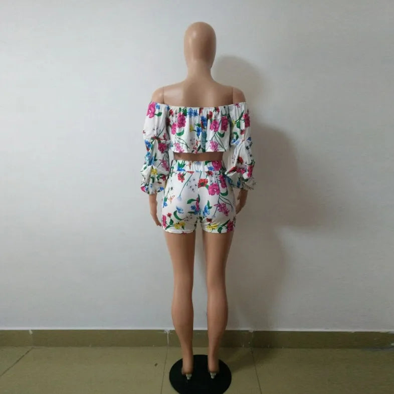 Women's two-piece set with multicolour digital print, pile sleeves on crop top, and matching shorts.
