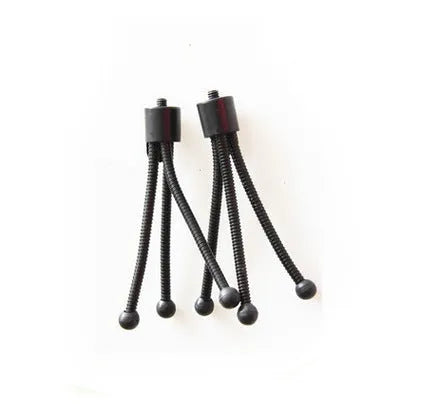 Small silver mini tripod with ball head shown extended on a desktop next to a mobile phone.