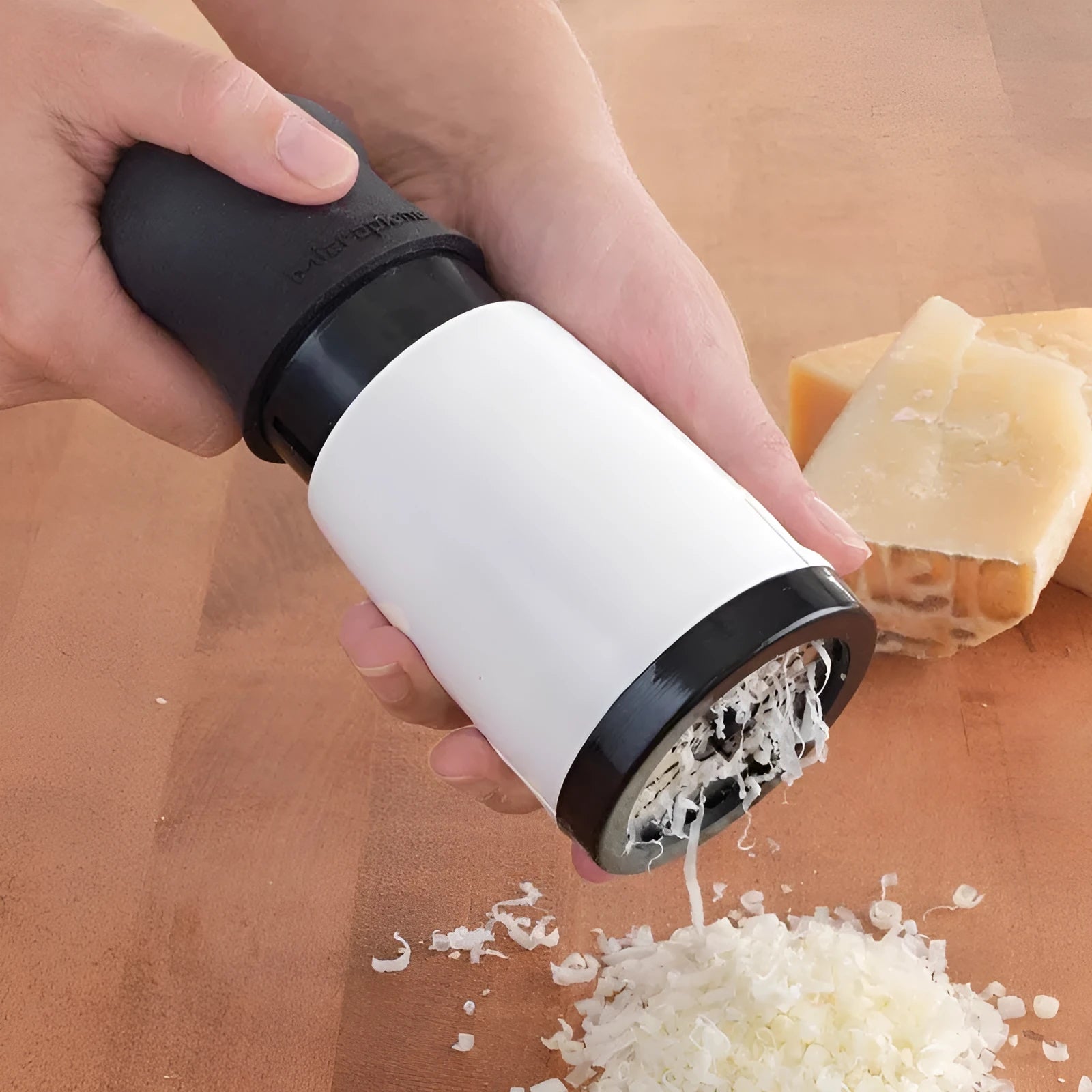 Stainless steel rotary cheese grater 17cm tall with black and white finish, hand crank and two blades