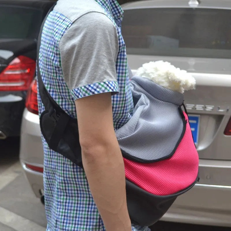 Blue pet backpack for a small dog, showing padded interior and shoulder straps.