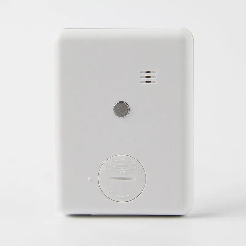 Black and white digital kitchen timer with magnetic back showing countdown display on 85mm circular face