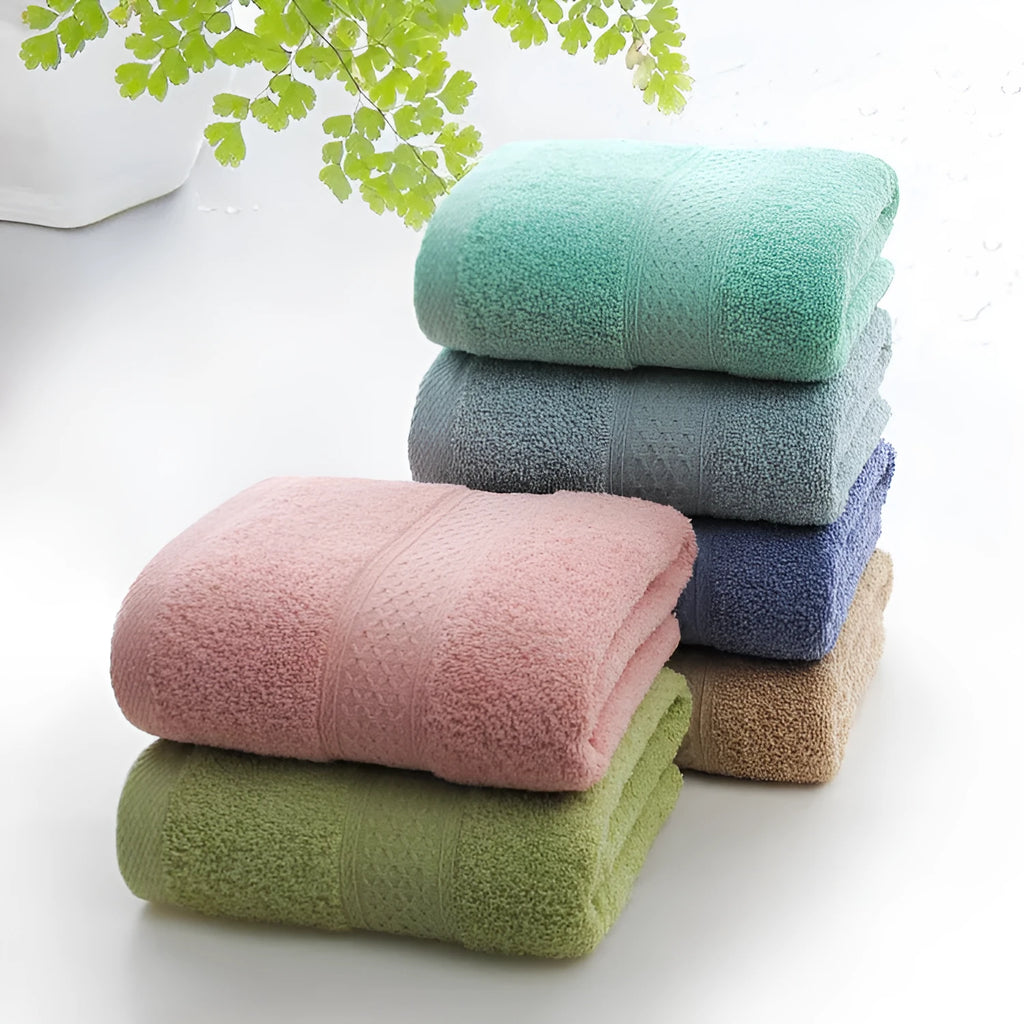 Thickened cotton blend bath and beach towel in apple green, dark blue, dark green, emerald green, light brown, or light pink.