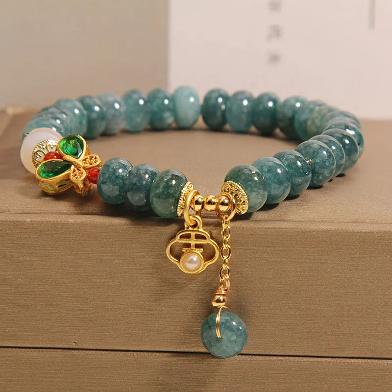 Blue water jade abacus beads crystal bracelet with butterfly clasp and white agate accents