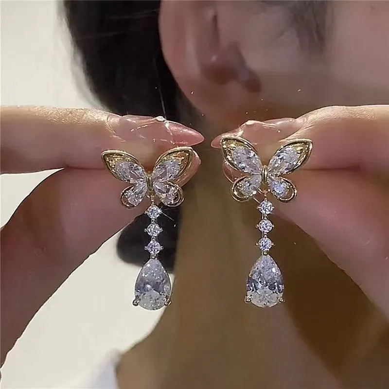 Platinum-coloured bow stud earrings with electroplated zinc alloy construction