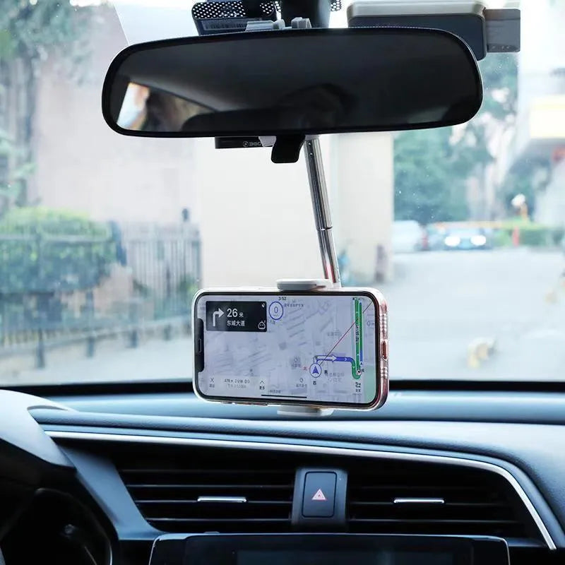 Black ABS mobile phone bracket attached to car rearview mirror holding smartphone