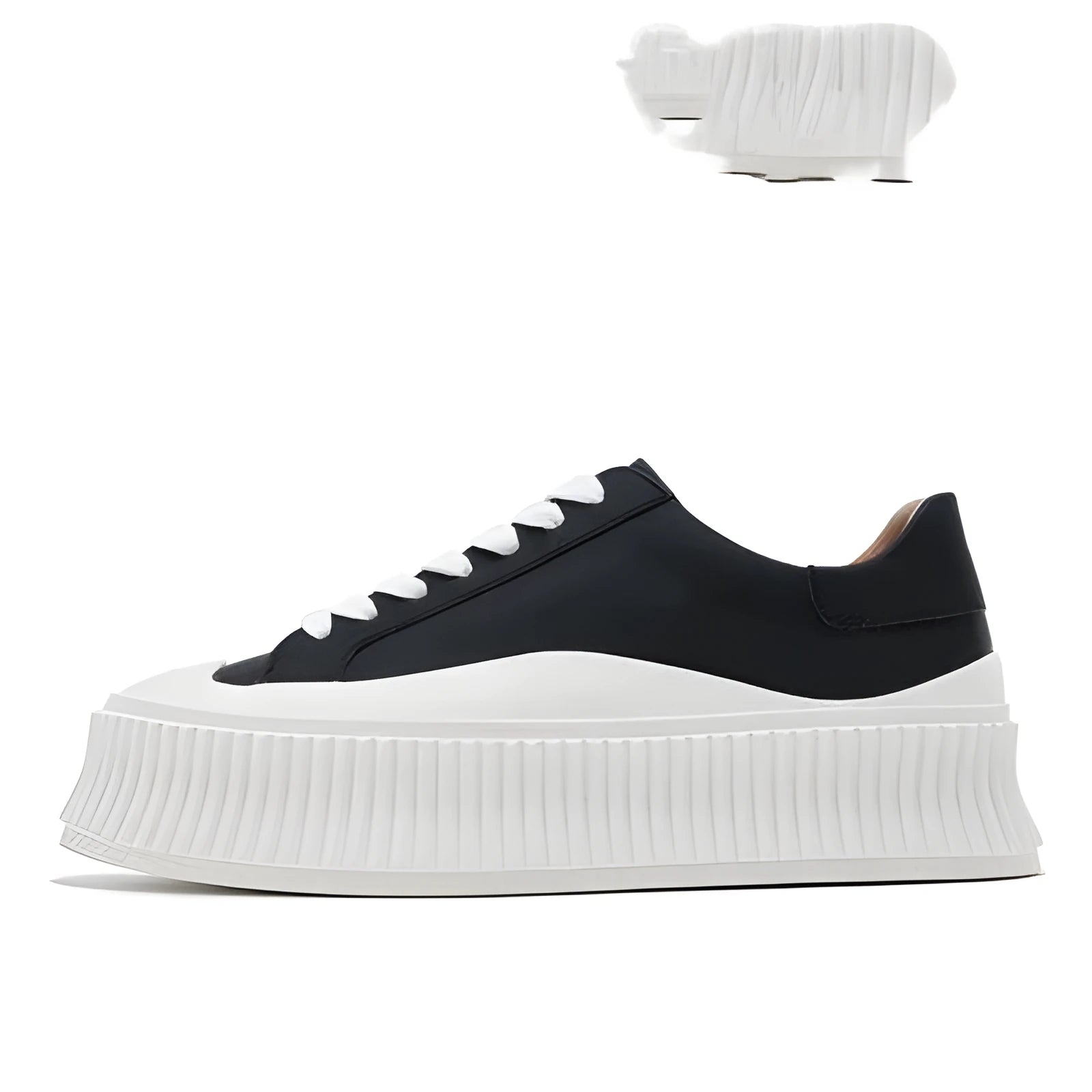 Women's black and white suede platform sneakers with back lacing and a thick sole for height increase.