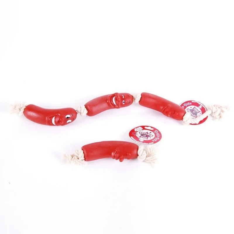Red silicone sausage gnaws pet toy with dental cleaning knots