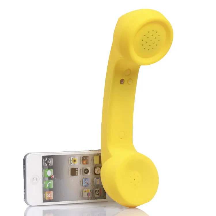 Retro phone style Bluetooth wireless headset in multiple colour options on a table.