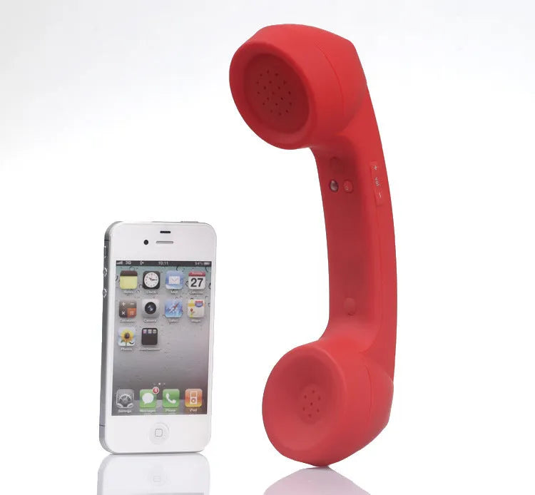 Retro phone style Bluetooth wireless headset in multiple colour options on a table.