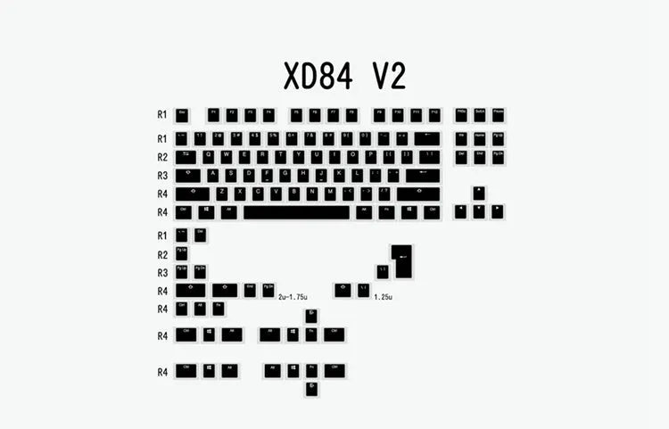 Black and white PBT pudding V2 doubleshot keycaps for mechanical keyboards on a dark background.