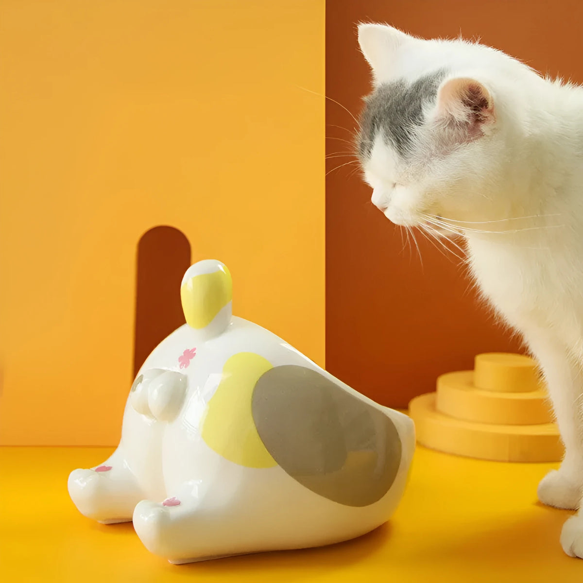 Ceramic pet bowl for cats and small dogs with inclined mouth and high foot, in cartoon cat styles