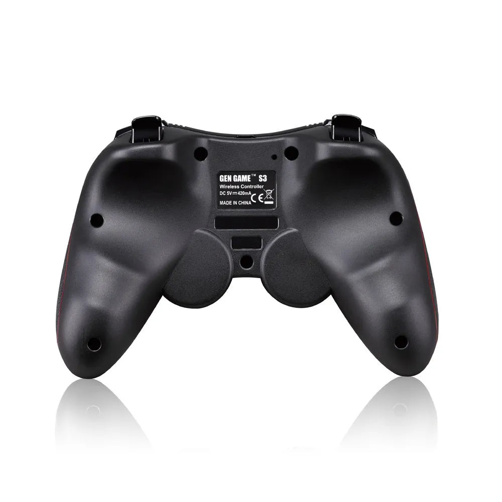Black wireless Bluetooth gamepad for mobile phones on a table next to a charging cable.