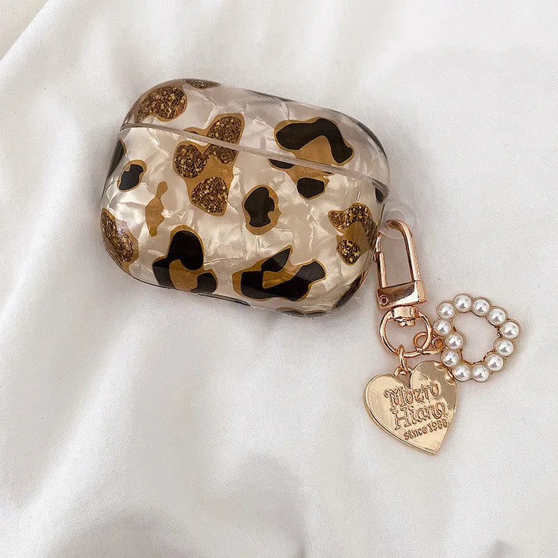 Shell yellow leopard print soft TPU flip case for Apple AirPods Pro on a table.