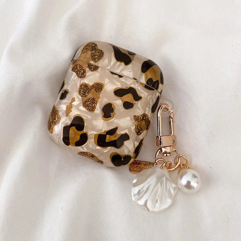 Shell yellow leopard print soft TPU flip case for Apple AirPods Pro on a table.