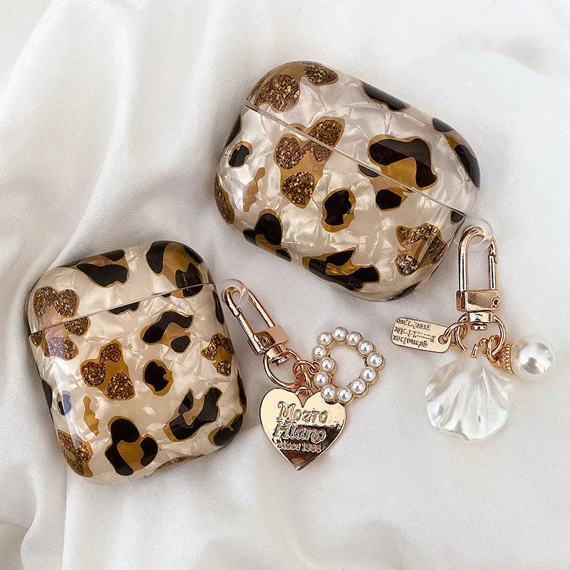 Shell yellow leopard print soft TPU flip case for Apple AirPods Pro on a table.