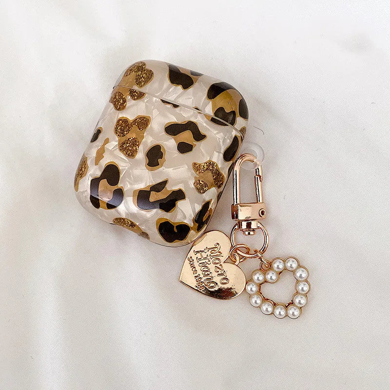 Shell yellow leopard print soft TPU flip case for Apple AirPods Pro on a table.