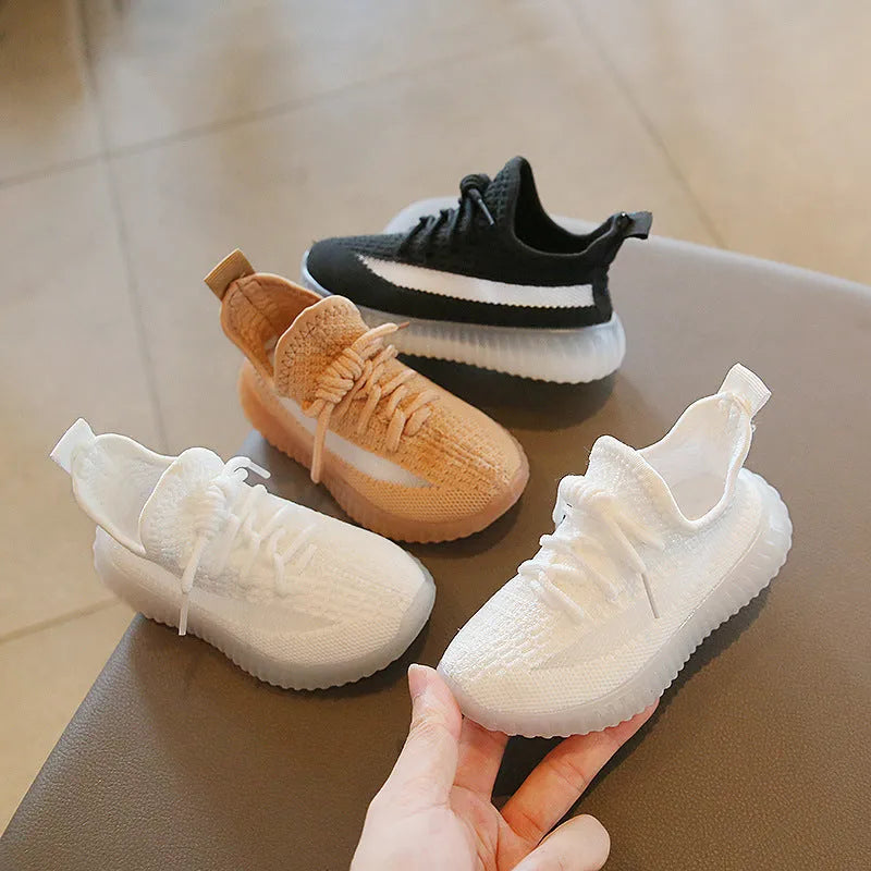 Children's sports shoes with fabric upper and rubber sole in black, khaki or white, sizes 21-32