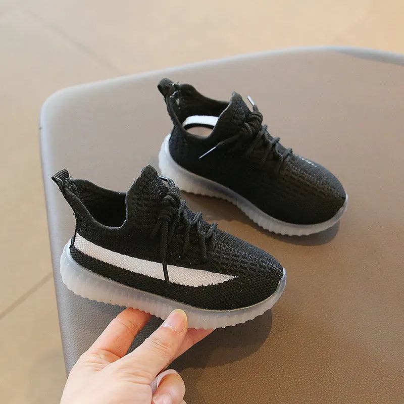 Children's sports shoes with fabric upper and rubber sole in black, khaki or white, sizes 21-32